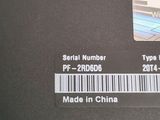 a picture of a serial number sticker on a laptop