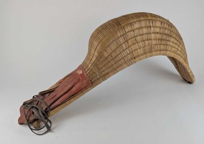 an image of a wooden paddle with a handle on a white background