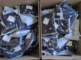 a box full of clothes that is sitting on the floor