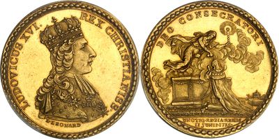 une pièce d'or sur laquelle figurent une femme et un oiseau