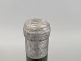 a bottle of wine that is sitting on a table
