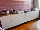 a kitchen with a lot of appliances on the counter