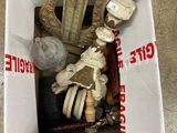 a box with a skeleton inside of it on the ground