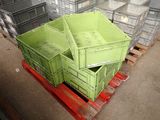 a pile of crates sitting on a pallet in a warehouse