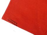 an image of a red cloth with black writing on it