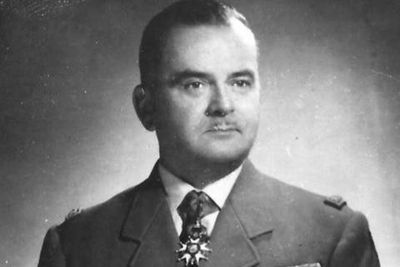 an old black and white photo of a man in a military uniform
