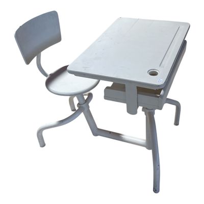 an image of a desk and chair with a laptop on it