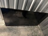 a close up of a flat screen tv sitting on top of a floor