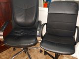 two black office chairs sitting next to each other on the floor