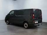 an image of a black van parked in a room