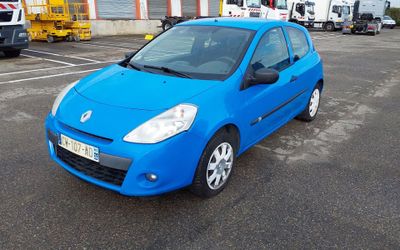 a blue car that is parked in a parking lot