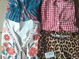 three different types of clothing are laid out on a table