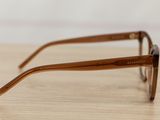 a close up of a pair of glasses on a table