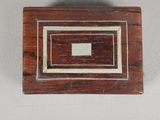 a small wooden box with a square in the middle
