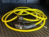 a yellow hose on the bed of a truck