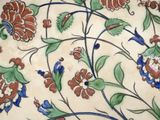 a plate with a floral design on it on a table