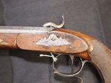 a close up of a gun that is on a table