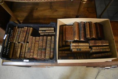 a box full of old books sitting on a table