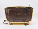 a brown radio sitting on top of a wooden stand