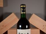 a bottle of wine that is sitting on a table