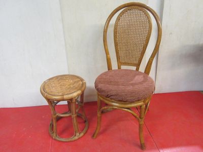 two chairs and a stool sitting on a red floor