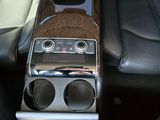 the interior of a car with a radio, speakers, and leather seats
