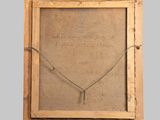 an old wooden frame with a necklace hanging from it ' s side