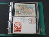 a green binder with a map and stamps on it