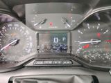 a close up of a car dashboard with a clock on it