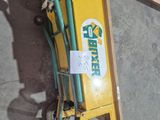 a small hand truck with a hose attached to it