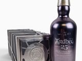 an image of a bottle of whisky next to a box of chocolates