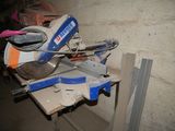 a mitre saw sitting on a table in a room
