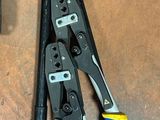 wires and pliers are laying on a table next to a pair of pliers