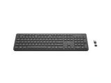 a black keyboard and mouse sitting on a white surface