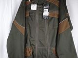 an image of a jacket hanging on a hanger on a wall