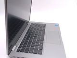 a close up of a laptop computer on a white surface