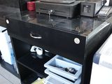 an image of a computer desk with a printer on it