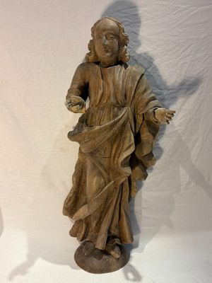 a statue of a man with a hat on a table