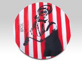 red and white striped plate with a picture of a man in a sailor ' s hat on it