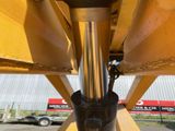 a close up of a fork on the back of a construction vehicle