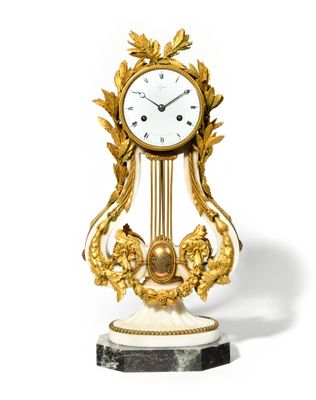 a clock that is sitting on a marble base