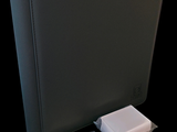 an image of a black binder with a usb attached to it