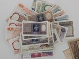 a pile of money sitting on top of a white table
