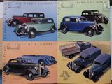 several old cars are lined up in a row on a table