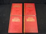 two red books sitting on top of a black table next to each other