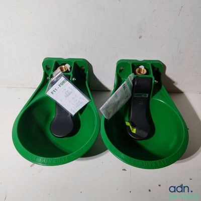 pair of green water fountains with tags attached to them on a table