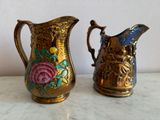 two vases that are sitting on a table