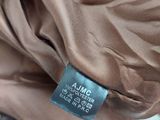 an image of a close up of a brown jacket with a label on it
