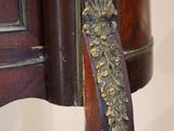 a close up of a wooden table with a metal handle