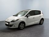 a picture of a small white car parked in a room
